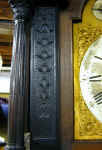 Hall_clock_architectural_hood_bellflower_detail.jpg (107794 bytes)